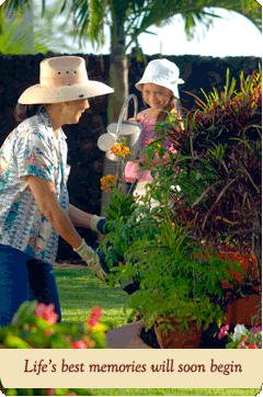 girl and daughter watering plants on Traditions property